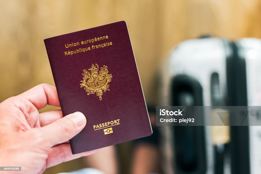 French passport and naturalisation documents on a desk